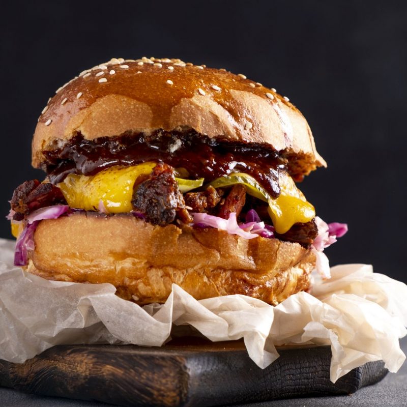 Beef burger with onion and cheese. Copy space. Banner.