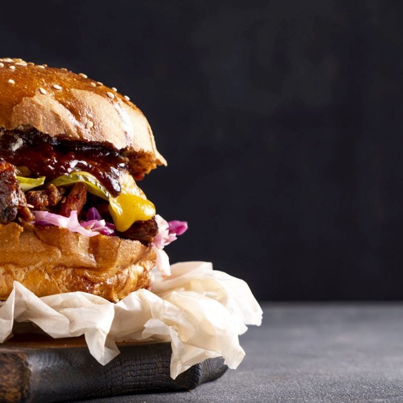 Beef burger with onion and cheese. Copy space. Banner.
