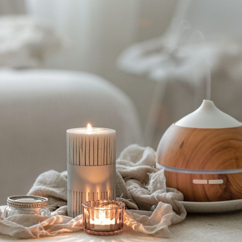 Still life with an aroma diffuser for moisturizing the air and burning candles.
