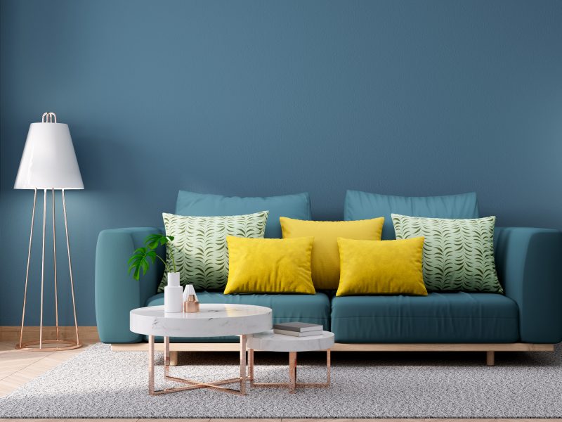 Modern Vintage interior of living room,,Blueprint home decor concept ,green couch with marble table on blue wall and Hardwood Flooring ,3d render